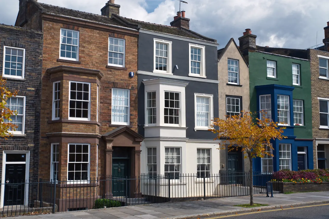 Conservation area street of period homes with uniform traditional windows