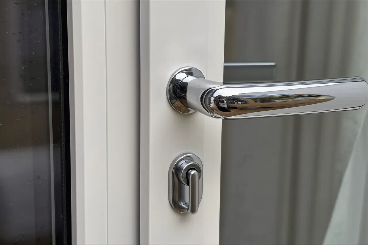 Close-up of modern window hardware, seals and a multi-point locking mechanism