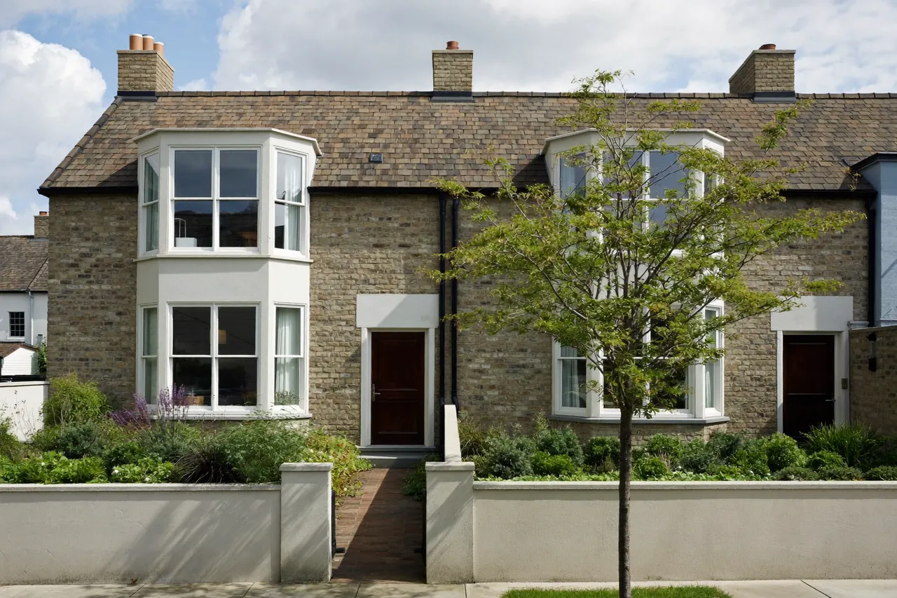 Pair of semi-detached houses with matching bay and casement windows